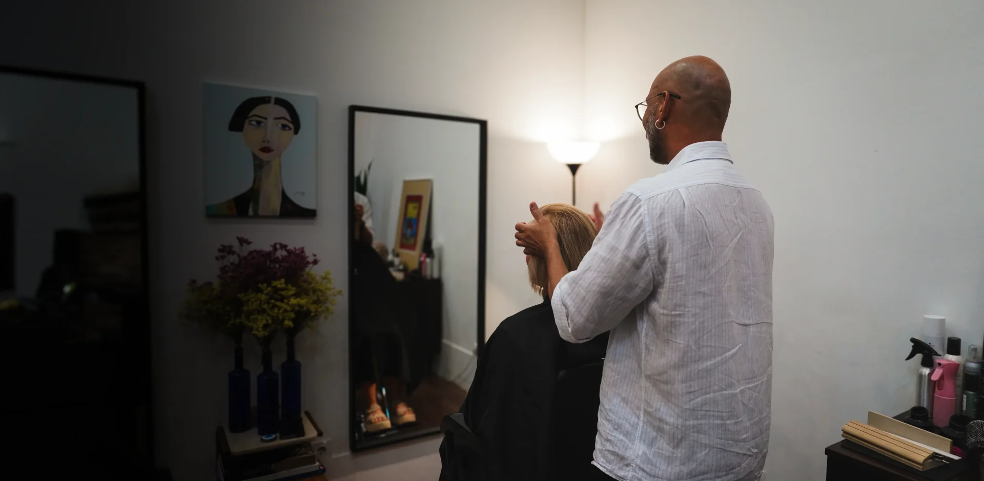 Hair stylist giving a modern womens haircut at our Lisbon salon